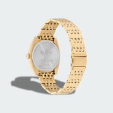 Close-up detail of the stainless steel bracelet on the Adidas Edition One Watch, showing the fold-over clasp and link texture.